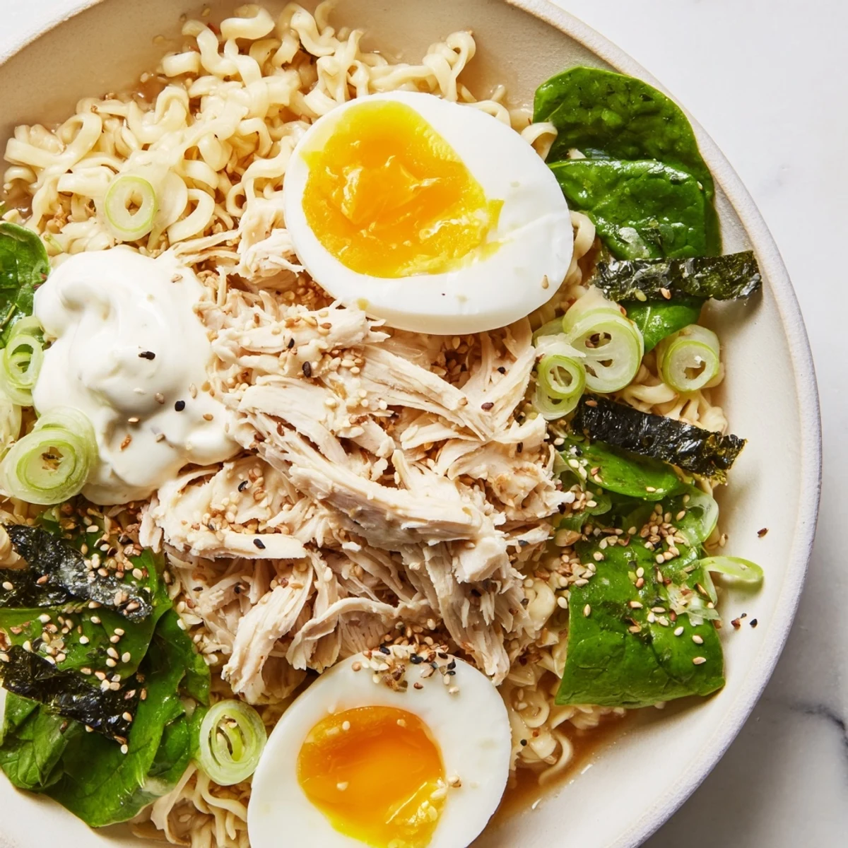 Creamy Chicken Ramen topped with soft egg, sesame seeds, and rich Kewpie mayo, a delicious Japanese fusion.