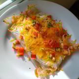 Golden-brown Rice Paper Egg Cheese Wrap, pan-fried to perfection, a quick and easy breakfast idea.