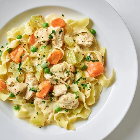 Tender Creamy Chicken and Egg Noodles, a warm bowl filled with savory comfort.